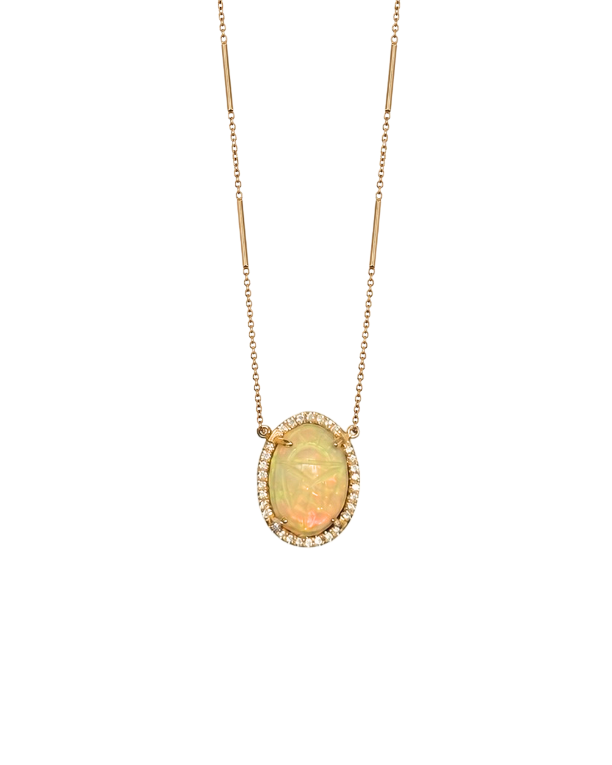 A gold necklace featuring an oval opal pendant with a halo of small clear stones, displayed against a solid white background.